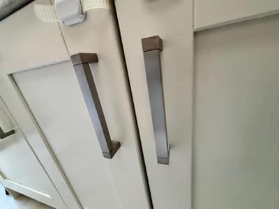 White kitchen cupboard doors and handles wiped clean