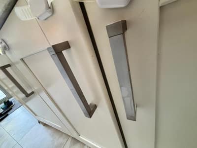 Clean kitchen cupboard fronts and handles