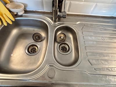Stainless steel sink cleaned and shining