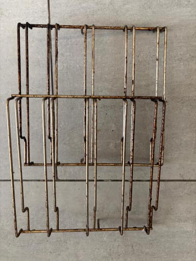 Greasy oven shelf runners before cleaning