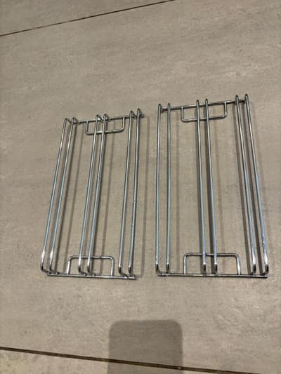 Oven shelf runners gleaming after cleaning