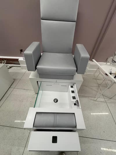Salon pedicure chair and basin after cleaning