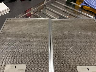 Pair of cooker hood filters after degreasing